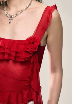 Asymmetric Hem Ruffled Sleeveless Top With Floral Accent -Modern Wear Shop 4c094c700d93aa0b0d573a81f7680597