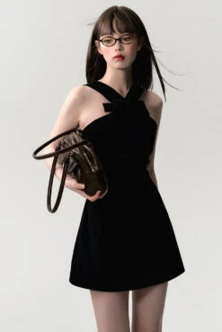 Sleeveless Mini Dress With Velvet Crisscross Neckline And Bow Detail -Modern Wear Shop 8d9aca88a2275c42785476996d861e76