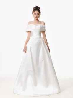 Off Shoulder Satin Gown With Draped Bodice And Bow Accents