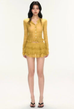 Sheer Ruffle Hem Button Knit Top And Tiered Mini Skirt Two-Piece Set -Modern Wear Shop c1b16a13e0bb1c274e798781199a2d83
