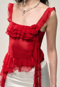 Asymmetric Hem Ruffled Sleeveless Top With Floral Accent -Modern Wear Shop d5dc768a706bfb2c1fdec8c168868328