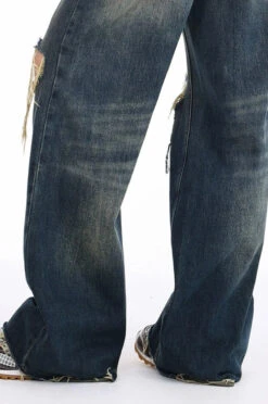 Distressed Wide-Leg Denim Jeans With Raw Hems -Modern Wear Shop dca4b9552a97f7d856e1c587576a33c0