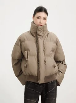 Puffer Jacket With Ribbed Hem And Zippered Pockets