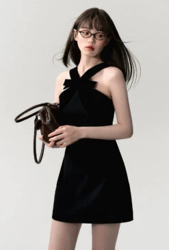 Sleeveless Mini Dress With Velvet Crisscross Neckline And Bow Detail -Modern Wear Shop f8afb5c669214fe457fe94d3a86f3bc6 1070384d c0b0 4fcd a251 0e3c81fb13a1